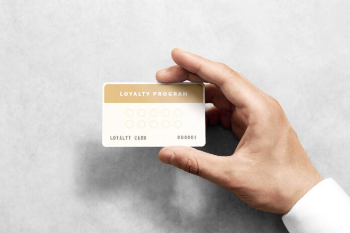 Hand hold loyalty card template with rounded corners.