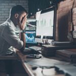 3 Big Marketing Missteps to Avoid in New and Emerging Markets business man with hands in face in front of computer