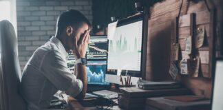 3 Big Marketing Missteps to Avoid in New and Emerging Markets business man with hands in face in front of computer