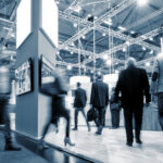 Is the Cannabis B2B Trade Show Model Broken? Can It Be Fixed? group of trade show attendees walking through the show floor