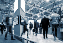 Is the Cannabis B2B Trade Show Model Broken? Can It Be Fixed? group of trade show attendees walking through the show floor