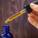 Is Oregon’s CBN Ban Responsible or Regressive Legislation? Concentrated CBD (cannabinoid) cannabis extract oil against wood background