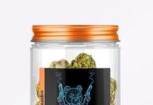 DJ Whoo Kid Partners with Mike Tyson on New Cannabis Venture Whoodini label on jar of nugs