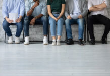 How to Combat Budtender Turnover Close up cropped shot of multiethnic group of young job applicants sitting in row at corporate office corridor preparing waiting for interview with hr feeling worry calm confident patient, copy space