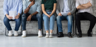 How to Combat Budtender Turnover Close up cropped shot of multiethnic group of young job applicants sitting in row at corporate office corridor preparing waiting for interview with hr feeling worry calm confident patient, copy space
