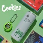 Green Monké Is Now the Global Beverage Partner for Cookies green monke beverage can on a green background with the cookies label in the upper right corner and a tomagatchi next to the can