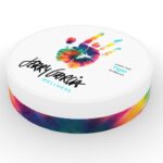 New CBD Brand Worthy of the Jerry Garcia Name Comes to Market white background tie dye container with jerry garcia logo on the top beneath a tie dye hand
