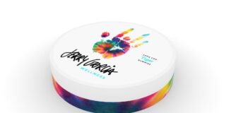 New CBD Brand Worthy of the Jerry Garcia Name Comes to Market white background tie dye container with jerry garcia logo on the top beneath a tie dye hand