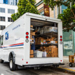 New Federal Bill Could Allow Small Growers to Sell Over State Lines August 10, 2019 San Francisco / CA / USA - USPS delivery van stopped in front of a UPS location, unloading Amazon packages