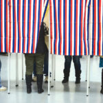 The American Voter Supports Cannabis Business Banking Access People Standing in Row of Voting Booths