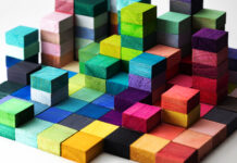 Champion Diversity by Learning How to Craft Inclusive Job Descriptions Spectrum of stacked multi-colored wooden blocks. Background or cover for something creative, diverse, expanding, rising or growing.