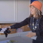 Join STIIIZY in Supporting Our Communities This Giving Season STIIIZY employee Sabrina helps distribute clothing items and necessities to other CANB clients