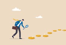 Two Industry Salary & Job Reports See the Money Moving East Searching for investment opportunity, financial success or salary raise, inspect way to make profit and earning concept, curios businessman with magnifier inspect and follow money coins trail.