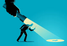 The Power and Potential of Third-Party Marketplaces Online marketplace businessman being guided by a hand holding a flashlight uncovering arrow sign.