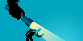 The Power and Potential of Third-Party Marketplaces Online marketplace businessman being guided by a hand holding a flashlight uncovering arrow sign.