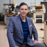 Jorge-Olson-Co-Founder-and-CMO-of-Hempacco-1 in sport coat inside cannabis lab