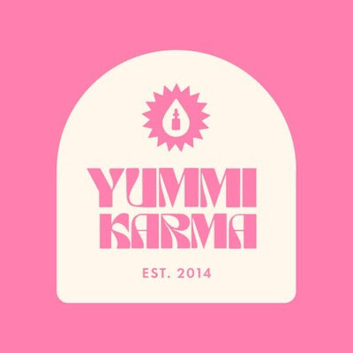 yummi karma logo pink background and cream logo