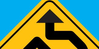 4 Paths to Raising Capital in the Cannabis Industry in 2023 yellow road sign with crooked black arrow pointing up