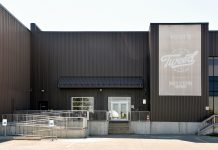 From Grower to Shower: What’s Next for Canopy Growth Corporation? Smiths Falls, ON, Canada - July 8, 2018: Canopy Growth Corporation, formerly Tweed Marijuana Inc in the former Hershey’s chocolate factory which they bought and expanded after Hershey’s left the town