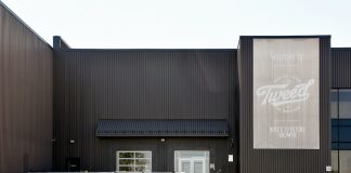 From Grower to Shower: What’s Next for Canopy Growth Corporation? Smiths Falls, ON, Canada - July 8, 2018: Canopy Growth Corporation, formerly Tweed Marijuana Inc in the former Hershey’s chocolate factory which they bought and expanded after Hershey’s left the town