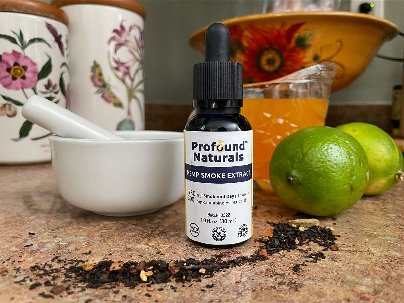 Profound Naturals CBD dropper on table with fruit and spices