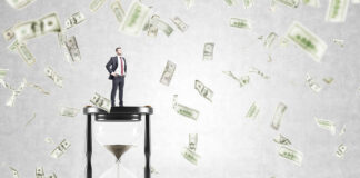 Some Cannabis Retailers Are Leaving Money on the Table Businessman standing on huge sand glass, dollars falling from above. Concept of time is money