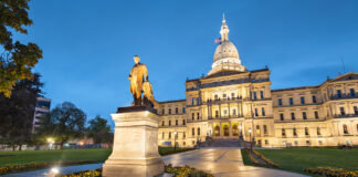 Former MI House Speaker Pleads Guilty in Cannabis Bribery Scheme Lansing, Michigan, USA at the Michigan State Capitol during the evening. (Governor Austin Blair statue dedicated in 1898)