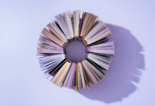 You Can’t Judge a Book by Its Cover … or Can You? Top,View,Of,Stack,Of,Books,In,Circle,On,Violet