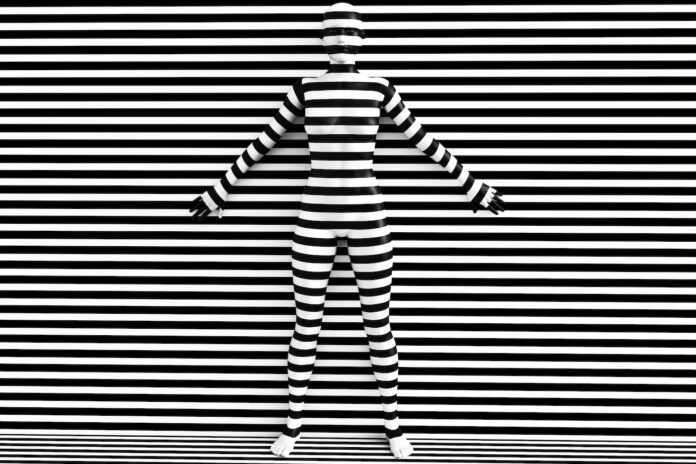 3D rendering of a woman trying to blend in with the black and white striped background, afraid to show her true colours. She is standing with her back against the wall and hiding like a wallflower.