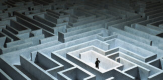 How to Land the Best Insurance Deal Businessman stand in front of maze entrance. Business problem solving, making decision, finding solution and challenge concept.