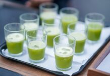How Free Samples Trigger Curiosity and Drive Brand Loyalty GREEN COLOR AVOCADO SMOOTHIE JUICE HALF GLASS FULL ON A TRAY