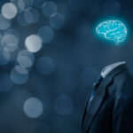 The Peril and Promise of AI Leader think about business, creativity, business vision and headhunter concept. Businessman without head just with brain, bokeh in background.