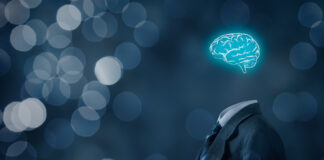 The Peril and Promise of AI Leader think about business, creativity, business vision and headhunter concept. Businessman without head just with brain, bokeh in background.