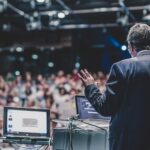 Marketing Comms: Overlooked Opportunities and Low-Hanging Fruit Public speaker giving talk at Business Event.