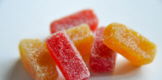 The Mainstream Appeal of Microdose THC Microdose Gummies in red and orange with a sugar coating