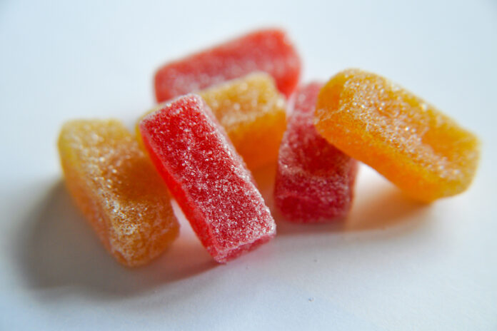 Microdose Gummies in red and orange with a sugar coating