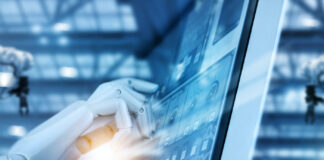 The Future is Automated Hand robot working on control panel in intelligent factory industrial monitoring system software. Check and control automation robot arms machine. Robotics and digital manufacturing operation system