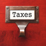 Cannabis Excise-Tax Revenue Fell Again in Q2 2023 Lustrous Wooden Cabinet with Taxes File Label