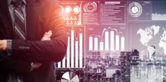 Cash Burn or Trust Earn: The Cannabis Investor’s Dilemma businessman in suit standing in front of a data analysis dashboards.