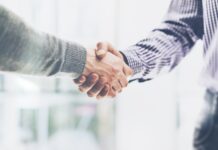 United Weed Stand: Managing the Growing Presence of Unions Business partnership meeting concept. Image businessmans handshake. Successful businessmen handshaking after good deal. Horizontal, blurred background