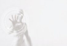 The Changing Face of Ecommerce Blurred White Robot Cyborg Man with Hand Touching on Motion Hi Tech Circle Interface HUD, Suitable for Technology Concept.