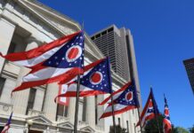 Ohio Republicans Vow to Undermine Will of Voters State of Ohio flags waving in front of the Statehouse in Columbus, OH