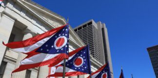 Ohio Republicans Vow to Undermine Will of Voters State of Ohio flags waving in front of the Statehouse in Columbus, OH