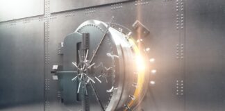 Fed Researchers: Rescheduling Won’t Improve Banking Access Open silver bank vault with golden light peeking from inside, 3D Render