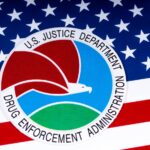 DEA Confirms Rescheduling Review DEA logo on american flag
