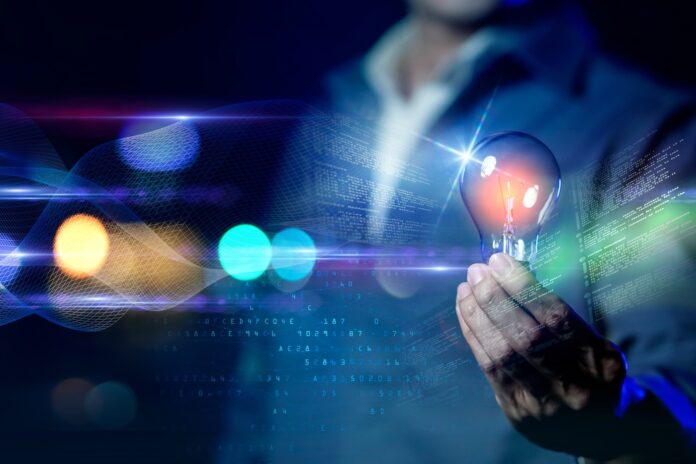 Business man holding light bulb with night colorful light background, technology idea creativity futuristic future business investment innovation.