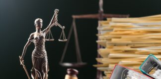 Slow but Significant Progress: Update on 3 Catalyst Cannabis Lawsuits Scales of justice, hammer, gavel, and legal files on a judges desk for glass house brands catalyst lawsuits