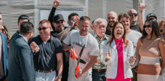 Green Horizons Cultivation Facility Ribbon-Cutting Ceremony Green Horizons CEO Los Arias Cuts The Ribbon with Fiona Ma