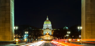 Pennsylvania’s Rec Market Could Generate $2.8 Billion in First Year Pennsylvania state capitol at night with car lights streaking through with open camera shutter