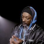 Futurola, Snoop Dogg Partner to Create International Accessories Brand Snoop Dogg wearing Futurola jacket mg Magazine